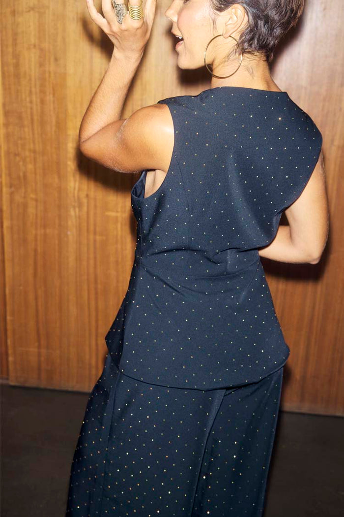 Black Hotfix Sol Waistcoat featuring gold sparkle embellishments and a sleeveless cut, shown from the back.