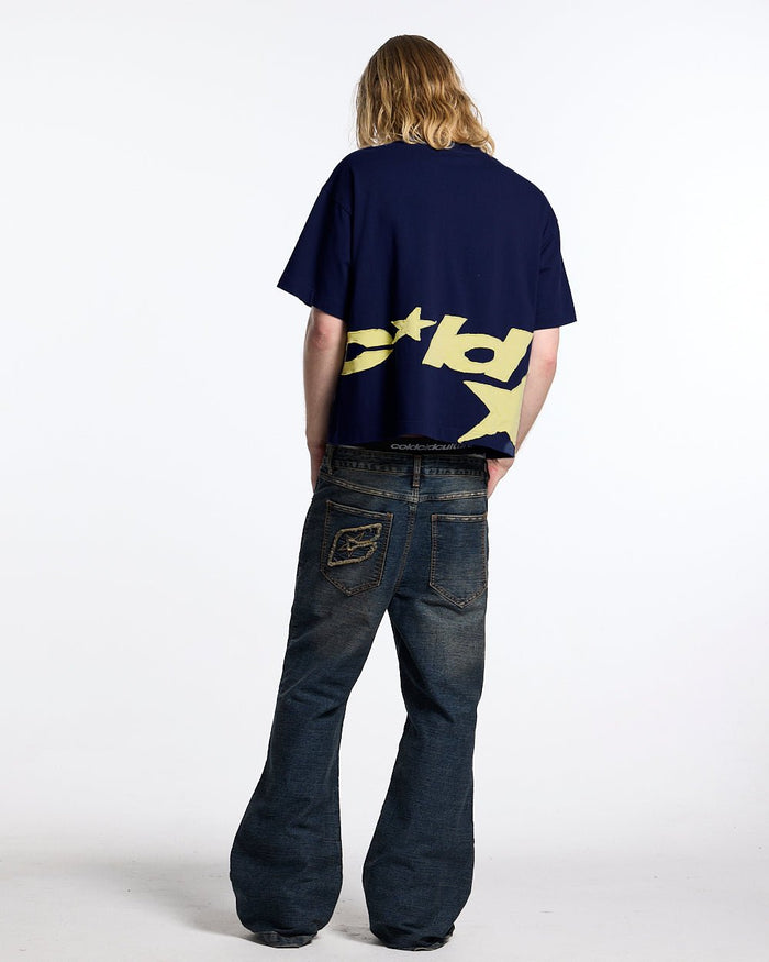 DISTRESS DEFENSE TEE NAVY - navy blue graphic print tee, back view on male model - Cold Culture