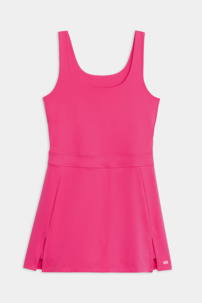 The SPLITS59 Martina Rigor Dress in Berry is a sleeveless athletic dress with a scoop neckline and side slits, crafted from Rigor fabric—ideal for court sports and high-impact workouts, shown laid flat on a white background.
