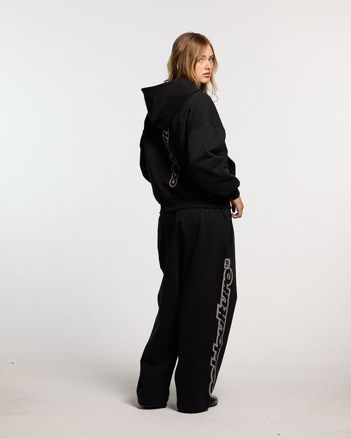 MIDNIGHT SET SWEATPANT BLACK - black logo print sweatpants, back view on female model - Cold Culture #woman