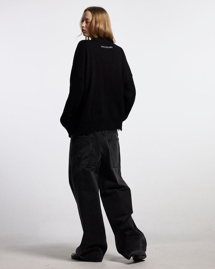 STARS KNIT BLACK - black distressed knit sweater, back view on female model - Cold Culture #woman