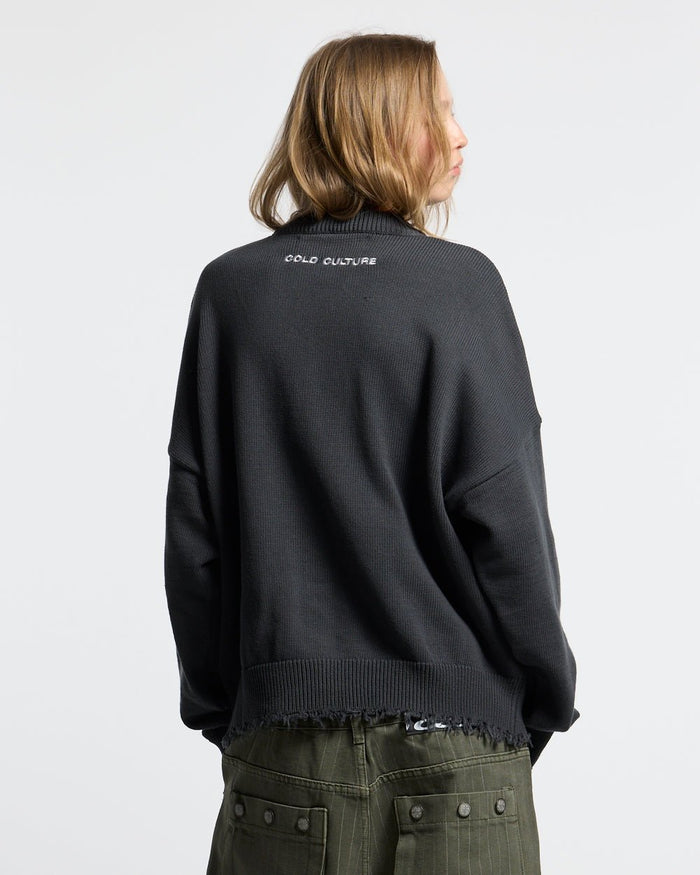 STARS KNIT INDIA INK - charcoal distressed knit sweater, back view on female model - Cold Culture #woman