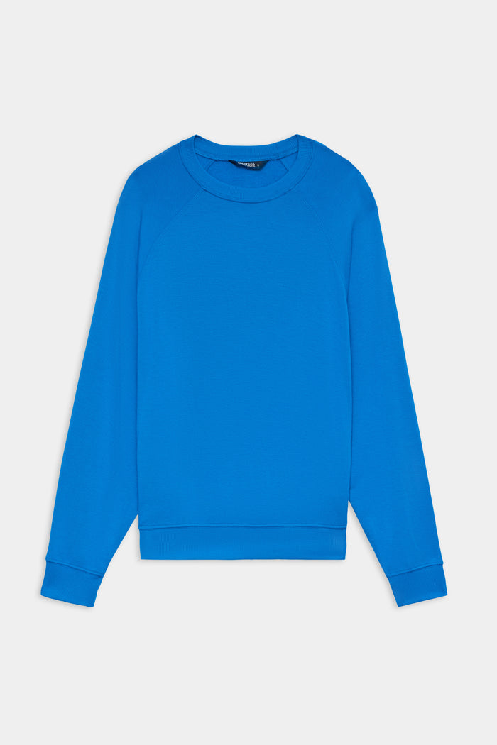 The SPLITS59 Andie Oversize Fleece Sweatshirt in Classic Blue features long sleeves and a crew neck, crafted from a soft modal blend, shown laid flat on a white background.