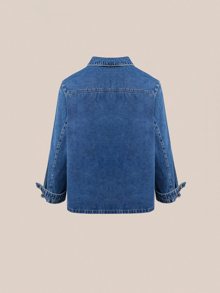 Rear view of a Found Azin Denim Pullover Work Shirt made from premium denim fabric on a neutral background.