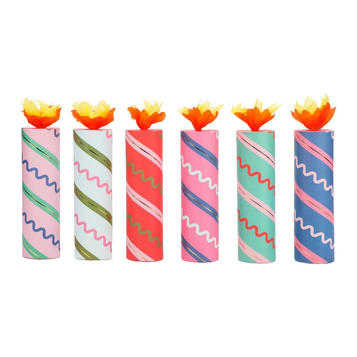 Set of colorful candles with wavy patterns on a white background