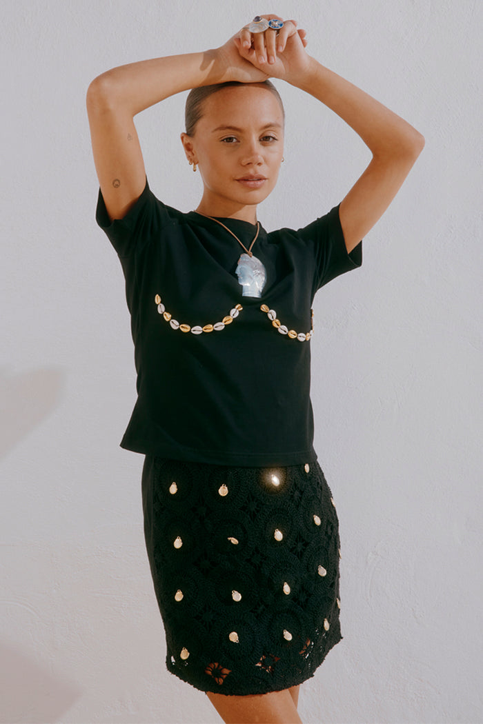 Black Shell Boob Tee and Crochet Shell Wrap Skirt with gold shell embellishments on a size 8 model.