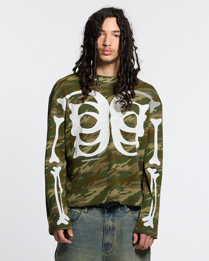 BONEY LONGSLEEVE CAMO - camo skeleton print longsleeve tee, front view on male model - Cold Culture #man