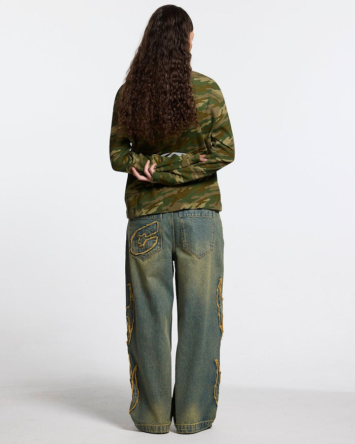 BONEY LONGSLEEVE CAMO - camo skeleton print longsleeve tee, back view on female model - Cold Culture #woman