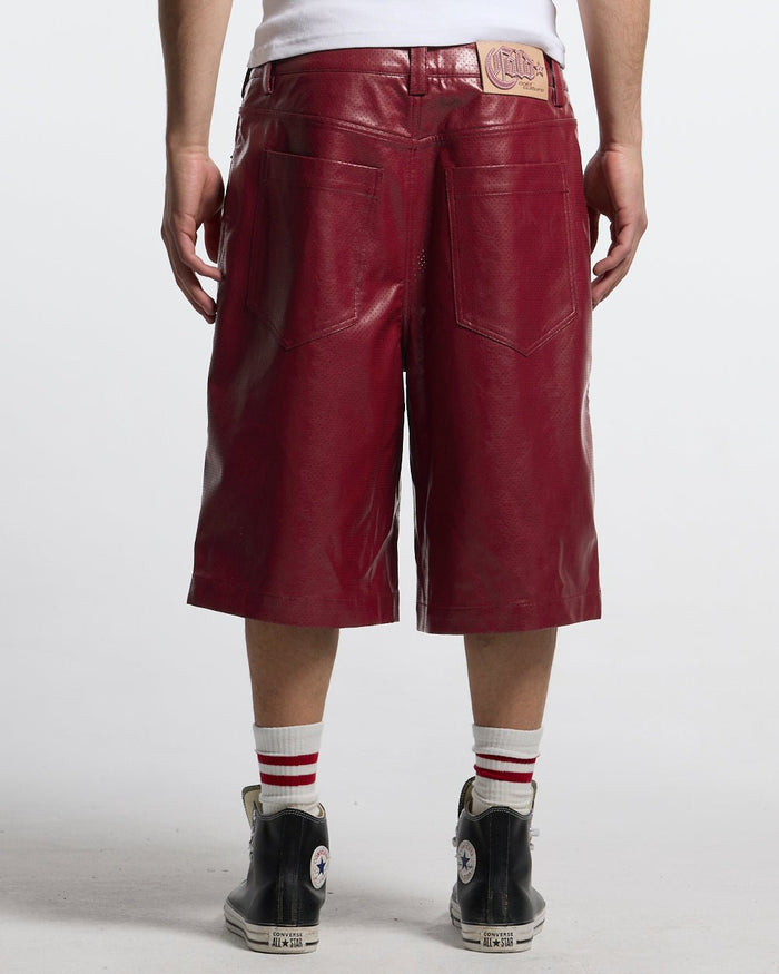 BRAVE SHORT BURGUNDY - burgundy perforated leather shorts, back view on male model - Cold Culture #man
