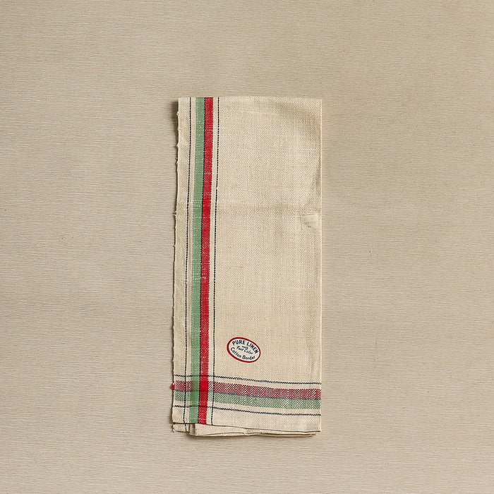 Charming vintage linen tea towel with red, green, and black borders and homespun texture c. 1940