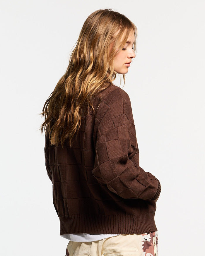 CHECKMATE KNITWEAR BROWN - brown checkerboard knit sweater, back view on female model - Cold Culture #woman
