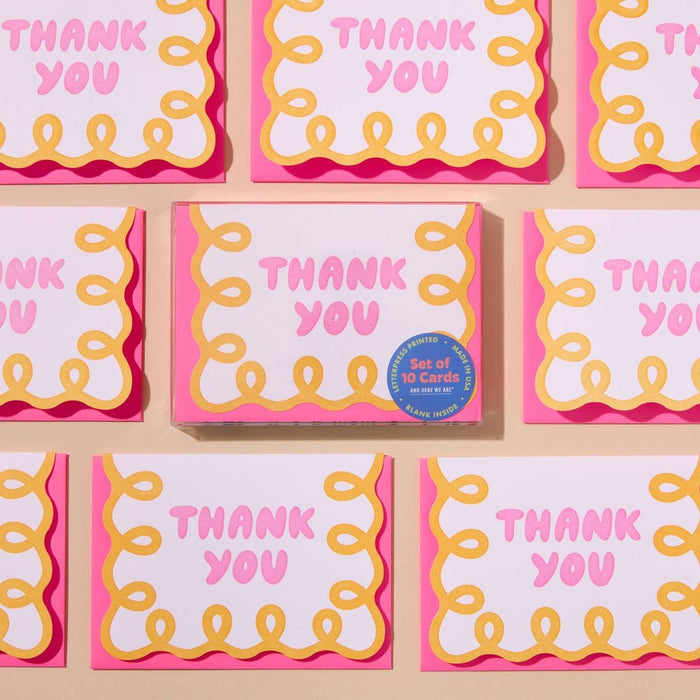 Set of 'THANK YOU' cards with pink and yellow design on a beige background