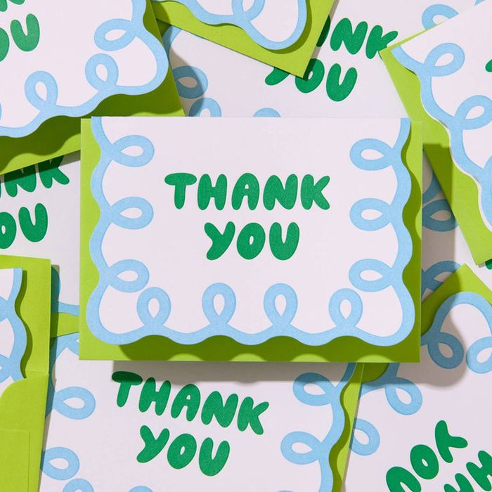 Green and blue 'Thank You' cards on a matching background