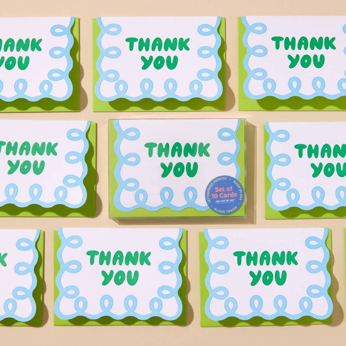 Set of 'THANK YOU' cards with green and blue design on a beige background