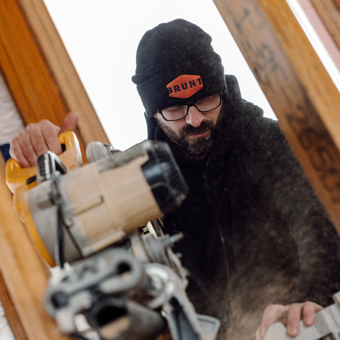 Man wearing high quality cuffed beanie in black and orange on jobsite * 1