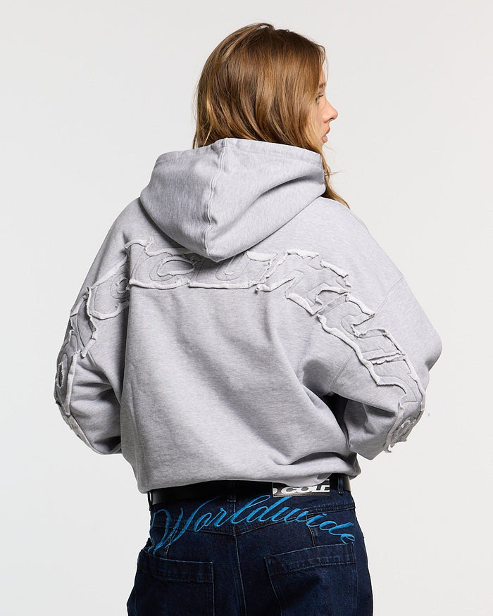DISTRESS CURVED HOODIE LIGHT GREY - light grey distressed hoodie, back view on female model - Cold Culture #woman