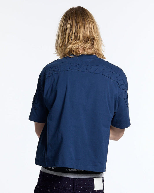 DISTRESS CURVED TEE NAVY - navy blue boxy tee, back view on male model - Cold Culture