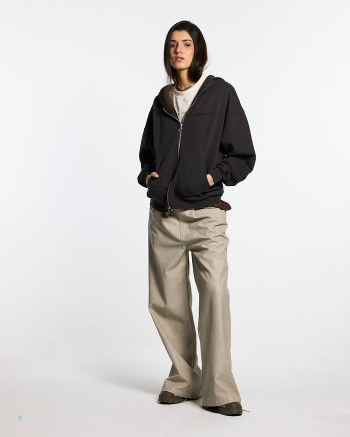 DISTRESS CURVED ZIP HOODIE DARK GREY - dark grey distressed zip-up hoodie, front view on female model - Cold Culture #woman
