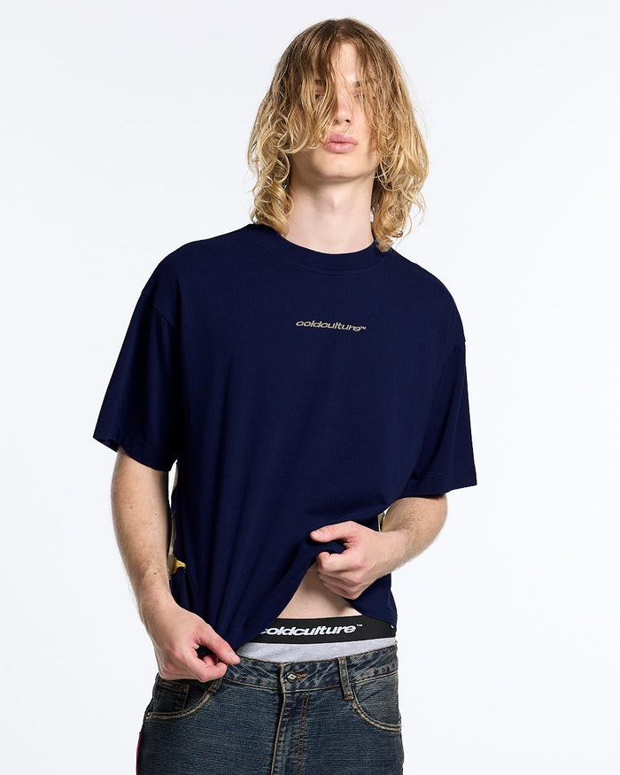 DISTRESS DEFENSE TEE NAVY - navy blue graphic print tee, front view on male model - Cold Culture