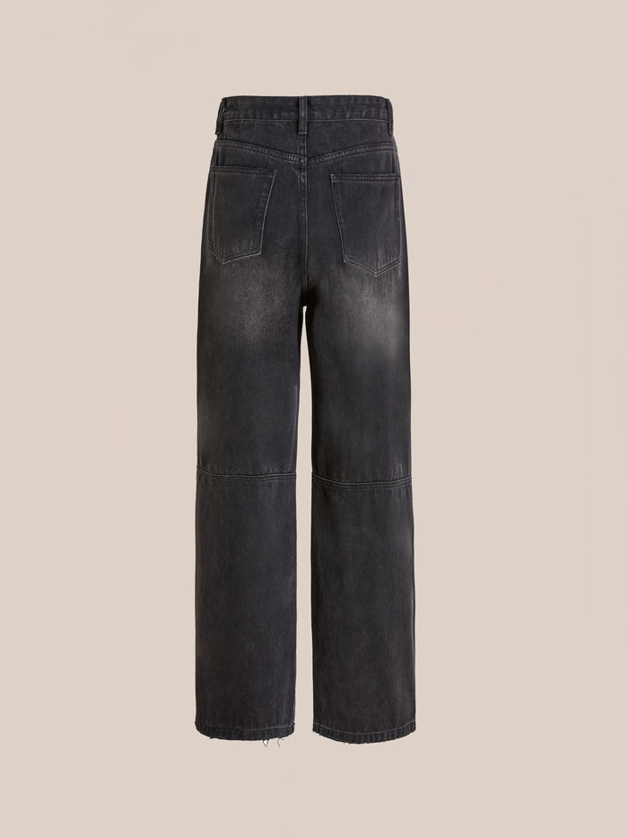 Back view of FOUND Double Knee Carpenter Jeans in black, featuring a wide-leg, relaxed fit with two back pockets and visible seam details on a plain beige background.
