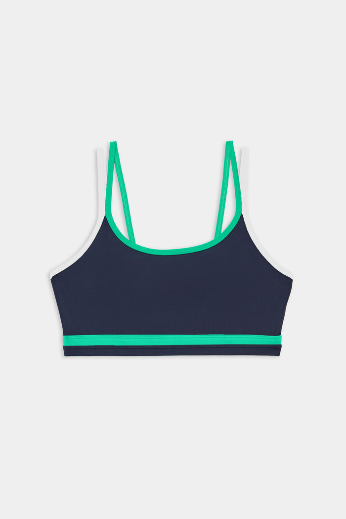 The SPLITS59 Eva Rigor Double Strap Bra in Indigo/Spearmint features thin shoulder straps and green trim, shown on a white background.