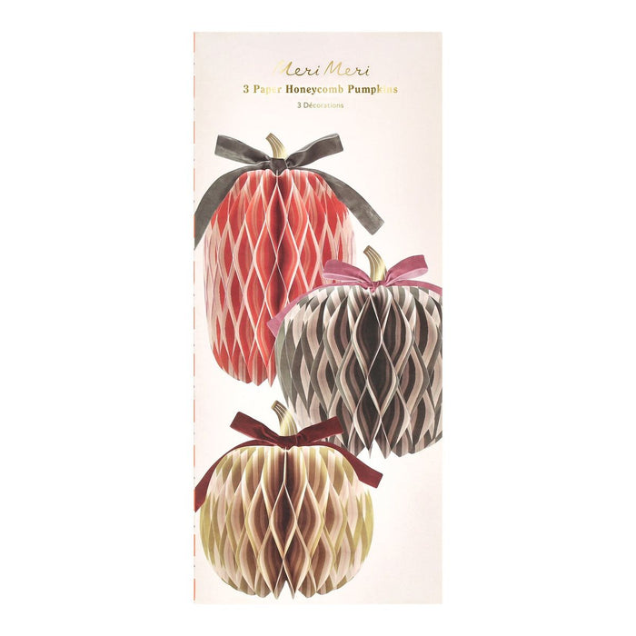Packaging of three paper honeycomb pumpkins with ribbons on a white background