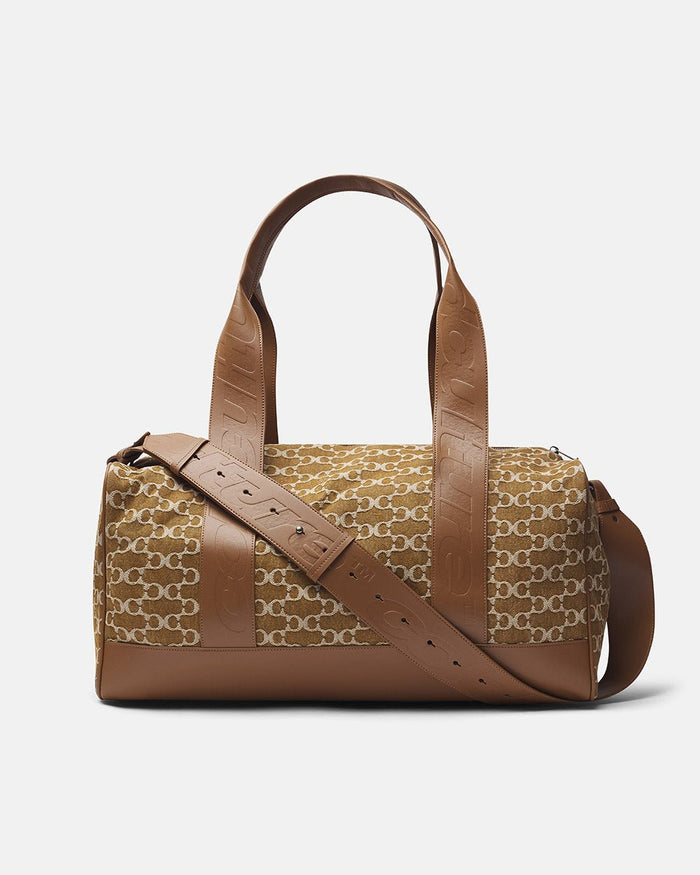 FEVER BAG BROWN - brown monogram duffle bag, side view - Cold Culture