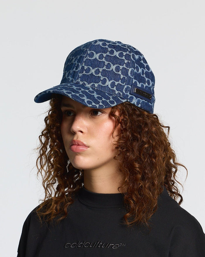 FEVER CAP BLUE - blue monogram cap, on model close-up - Cold Culture #woman