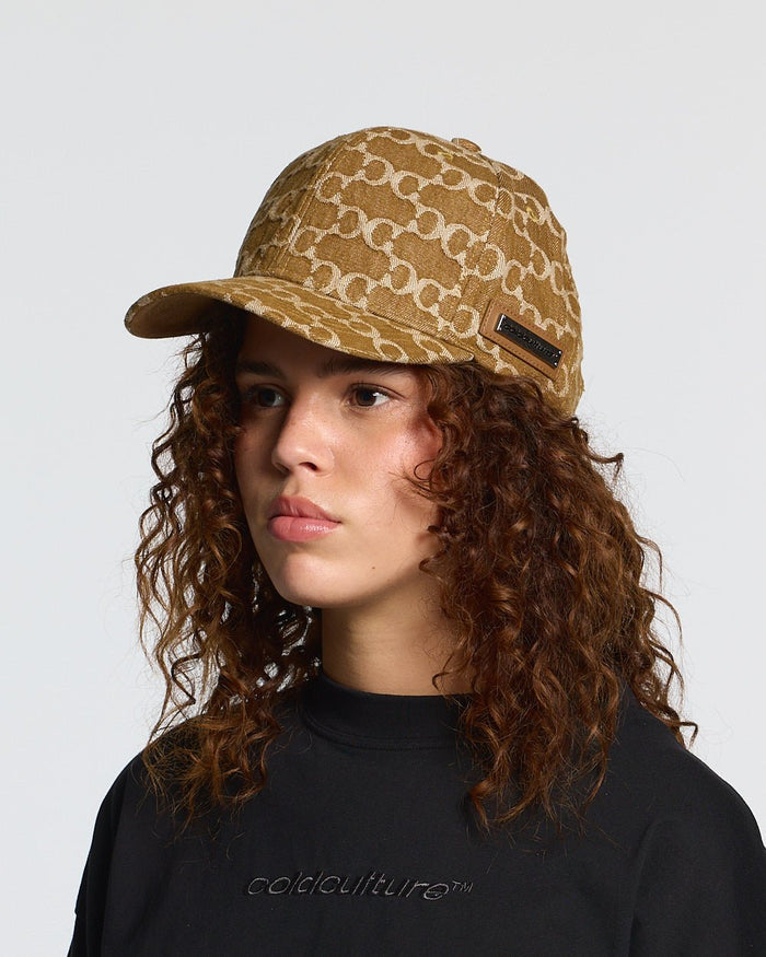 FEVER CAP BROWN - brown monogram cap, on model close-up - Cold Culture #woman