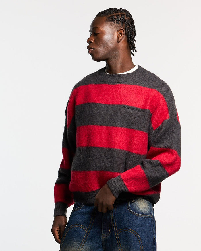 FLUFFY FUR KNIT BLACK & RED - black and red striped knit sweater, front view on male model - Cold Culture #man