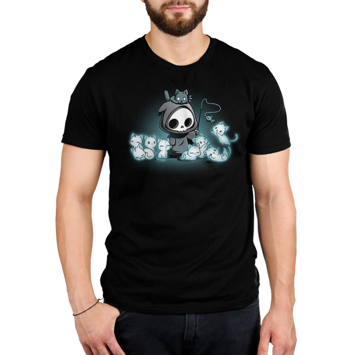 Men's Premium T-Shirt_TeeTurtle Grim and Kitties black t-shirt featuring a hooded skeleton figure, resembling a spooky Grim Reaper, standing surrounded by glowing ghostly cats. One cat is perched on its head while it playfully dangles a toy fish in front of the others.