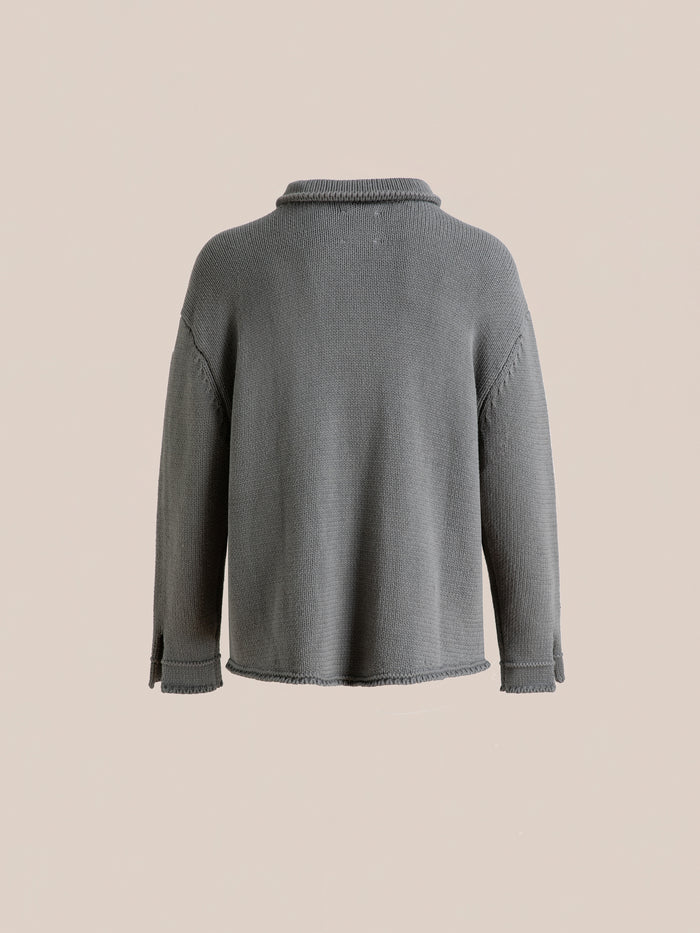 Back view of the Hunter Knit Collared Cardigan by FOUND in gray against a plain beige background. This cardigan is enhanced with subtle seam details on the sleeves and sides, complemented by a cozy collar.