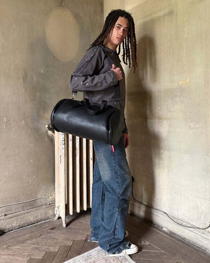LARGE BRAVE BAG BLACK - black duffle bag, street style shot - Cold Culture