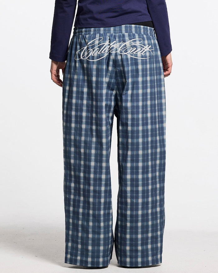 LIAR PANTS BLUE - blue plaid women's sweatpants, back view on female model - Cold Culture