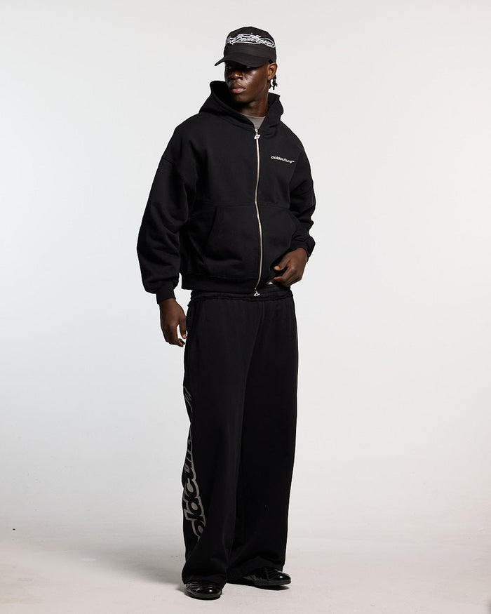 MIDNIGHT SET SWEATPANT BLACK - black logo print sweatpants, front view on male model - Cold Culture #man