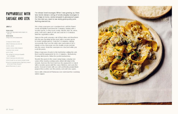 Pappardelle with Sausage and Leek on a plate with text on the left side.