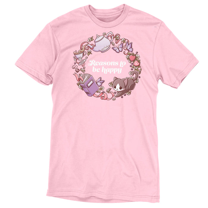 Premium Cotton T-shirt_TeeTurtle light pink Reasons to be Happy apparel featuring the caption, “Reasons to be Happy“ surrounded by a wreath with a cat, tea, flowers, books, butterflies, and strawberries.