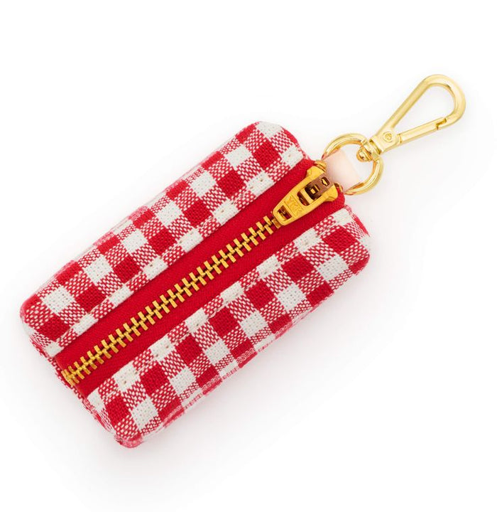 Red and white checkered pouch with gold zipper and keychain clip on a white background