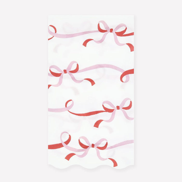Pattern of pink and red ribbons on a white background
