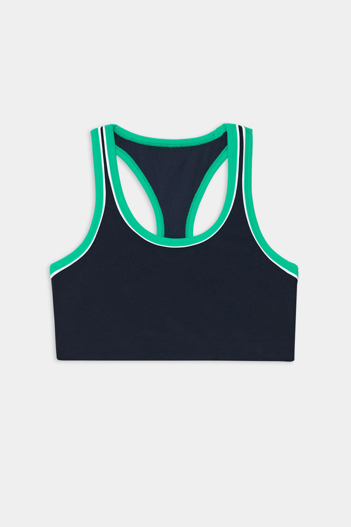 The SPLITS59 Robbie Airweight Bra in Indigo/Spearmint features green and white trim, a racerback design, and is crafted from a spandex-nylon blend. Shown laid flat on a white background, back view.