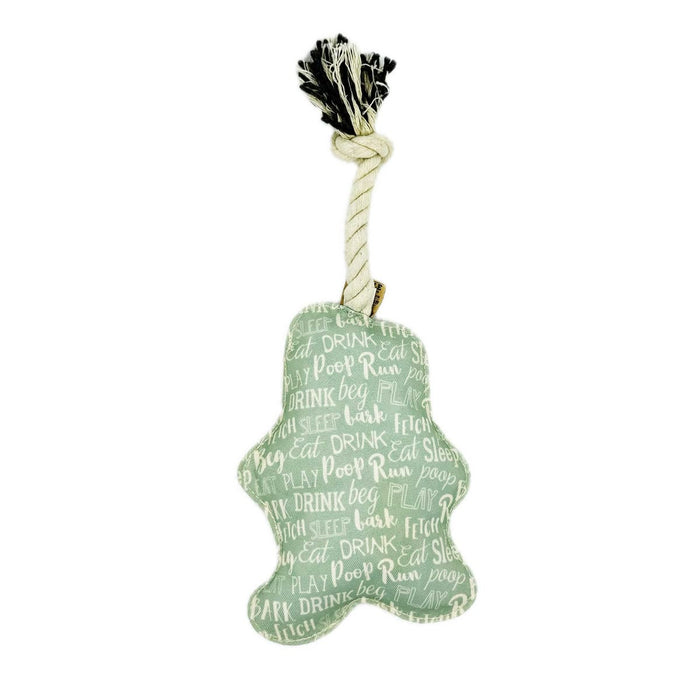 Dog toy with a green plush body and black pom-pom on a white background