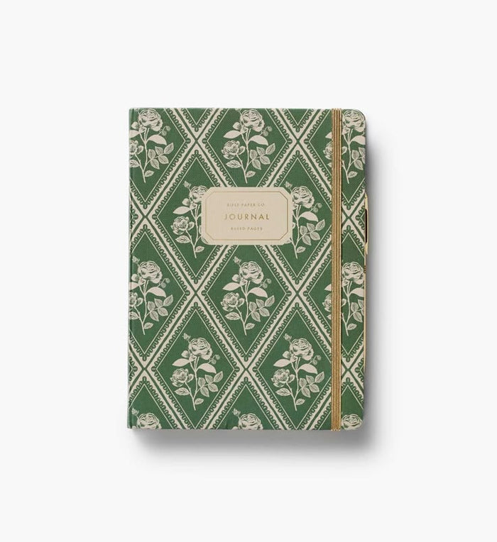 Journal with green floral pattern on a white background
