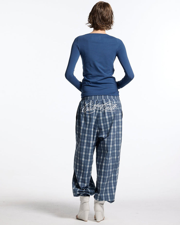 ROUGH LONGSLEEVE TEE BLUE - blue script print longsleeve tee, back view on female model - Cold Culture