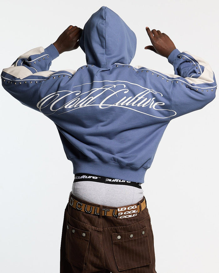 SCRIPT STUDS HOODIE BLUE - blue studded hoodie, back view on male model - Cold Culture #man
