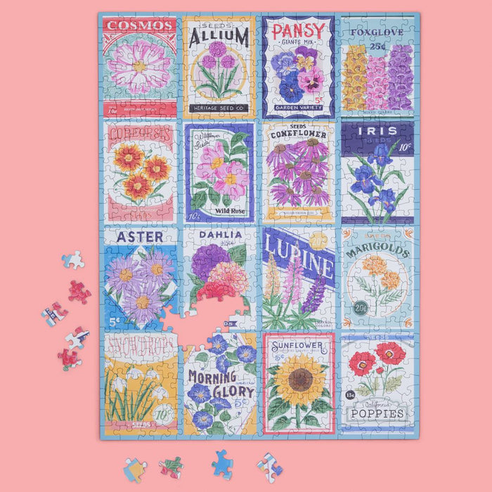 Floral seed packet puzzle on a pink background with scattered pieces.
