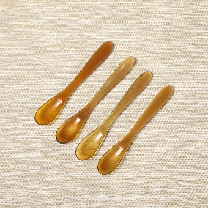 Set of four polished horn spice spoons