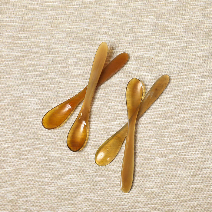 Set of four polished horn spice spoons