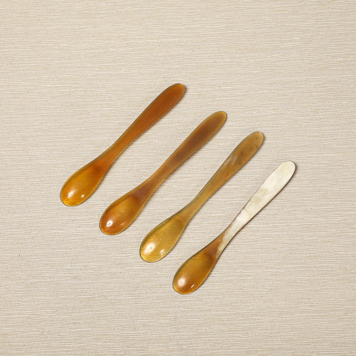 Set of four polished horn spice spoons