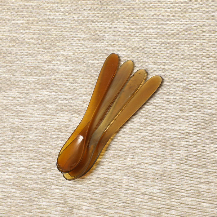 Set of four polished horn spice spoons