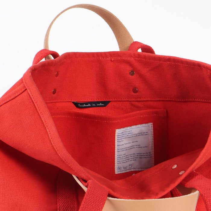 Red bag with a visible label on a white background